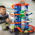 Невообразимый гараж Hot Wheels c тиранозавром GJL14 Невообразимый гараж Hot Wheels c тиранозавром GJL14 фото
